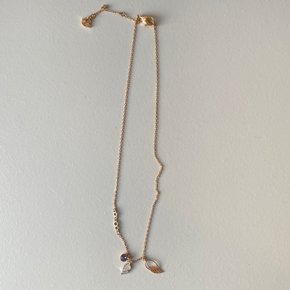 Swarovski necklace with charms.